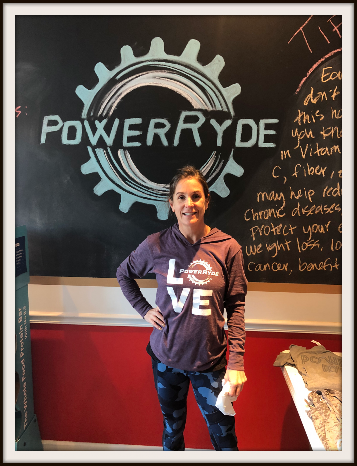 Karen Robinson in front PowerRyde chalk logo